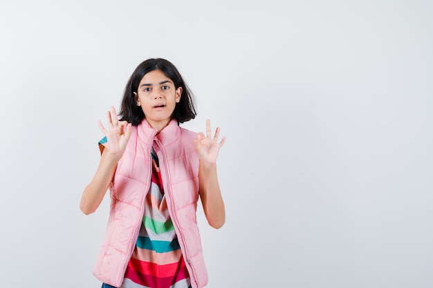 Expressive young girl posing in the studio