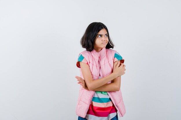 Expressive young girl posing in the studio