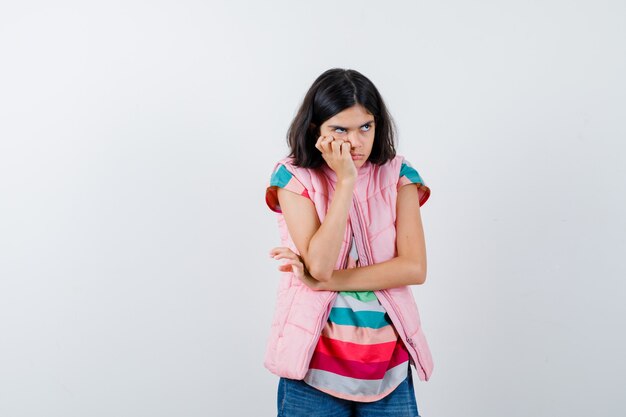 Expressive young girl posing in the studio