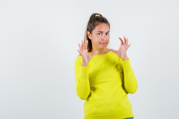 Expressive young girl posing in the studio