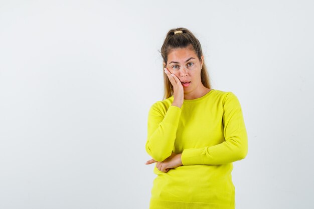 Expressive young girl posing in the studio