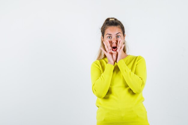 Expressive young girl posing in the studio