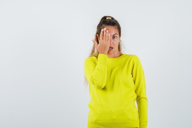 Expressive young girl posing in the studio