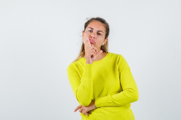 Expressive young girl posing in the studio