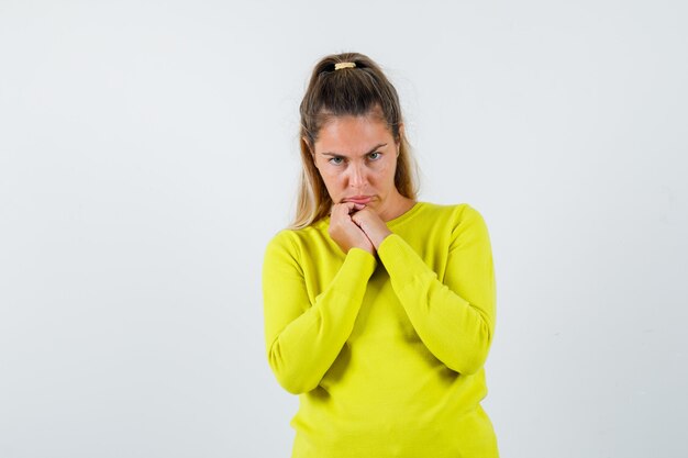 Expressive young girl posing in the studio