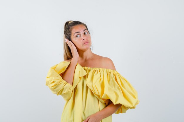 Expressive young girl posing in the studio