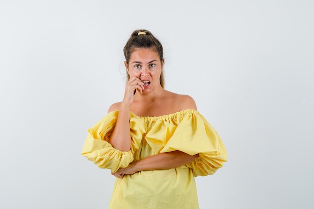 Expressive young girl posing in the studio