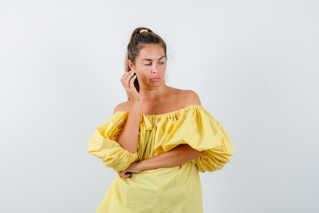 Expressive young girl posing in the studio