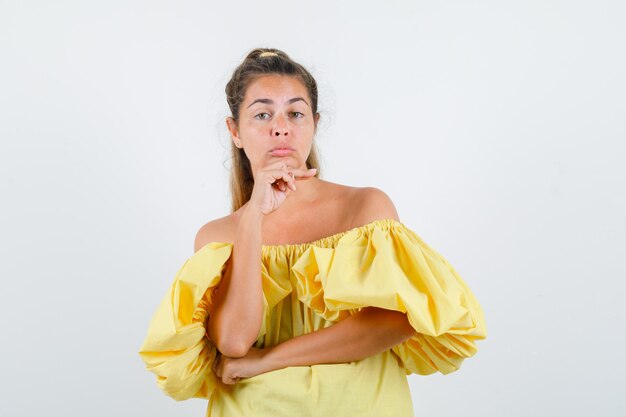 Expressive young girl posing in the studio