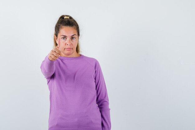 Expressive young girl posing in the studio