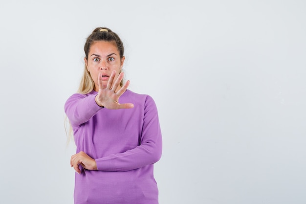 Expressive young girl posing in the studio