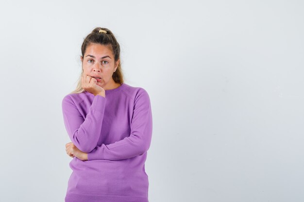 Expressive young girl posing in the studio