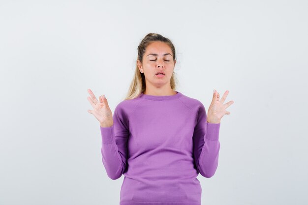 Expressive young girl posing in the studio