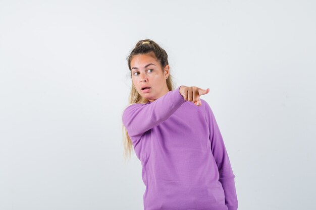 Expressive young girl posing in the studio