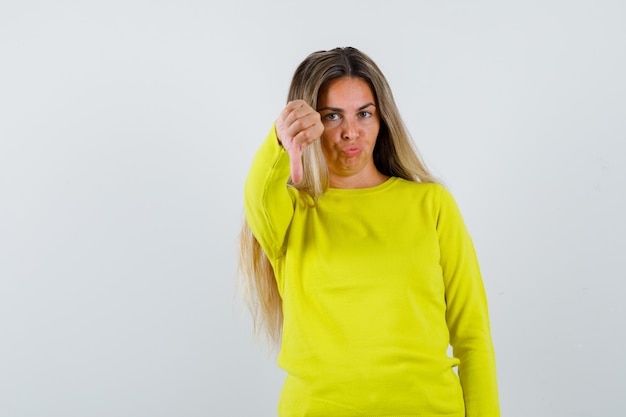 Expressive young girl posing in the studio