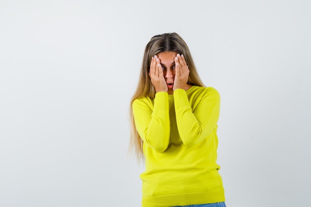 Expressive young girl posing in the studio