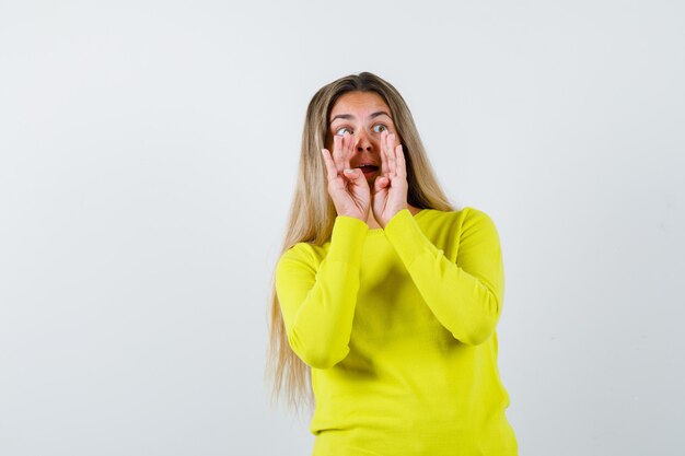 Expressive young girl posing in the studio