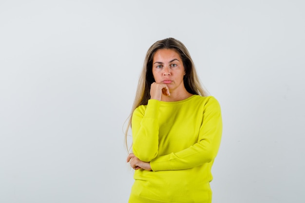 Expressive young girl posing in the studio