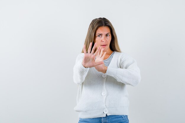 Expressive young girl posing in the studio