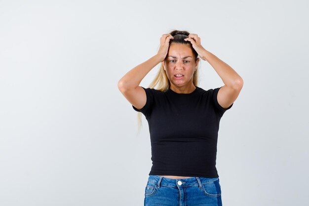 Expressive young girl posing in the studio