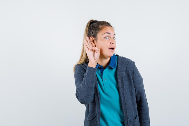 Expressive young girl posing in the studio