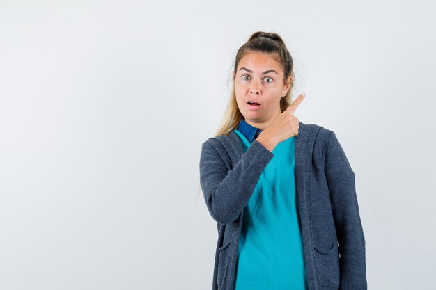 Expressive young girl posing in the studio