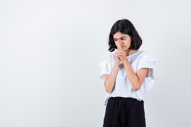 Expressive young girl posing in the studio