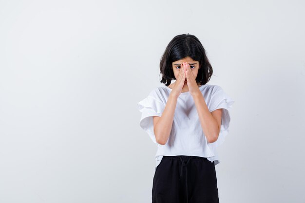 Expressive young girl posing in the studio