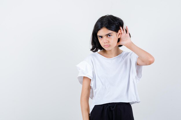 Expressive young girl posing in the studio