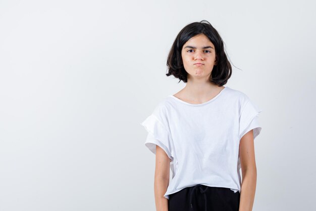 Expressive young girl posing in the studio