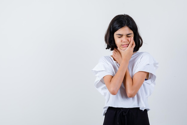 Expressive young girl posing in the studio