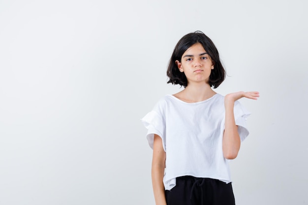 Expressive young girl posing in the studio