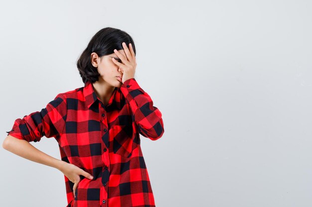 Expressive young girl posing in the studio