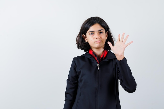 Expressive young girl posing in the studio