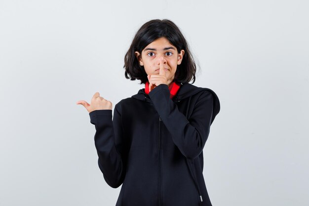 Expressive young girl posing in the studio