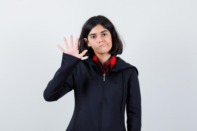 Expressive young girl posing in the studio