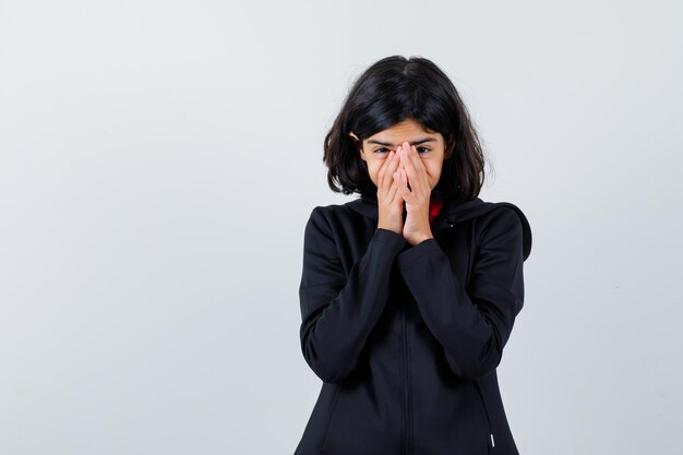 Expressive young girl posing in the studio