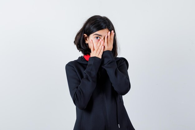 Expressive young girl posing in the studio