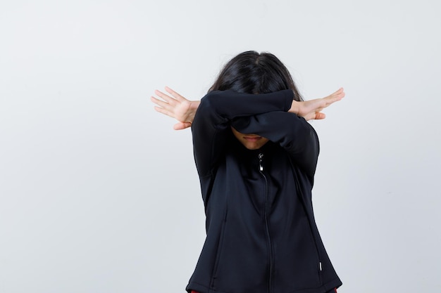 Expressive young girl posing in the studio