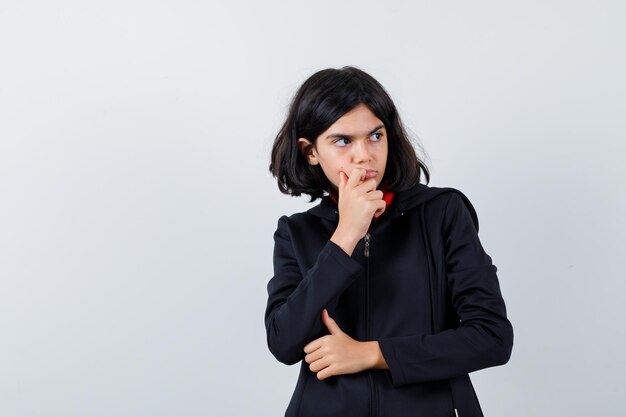 Expressive young girl posing in the studio