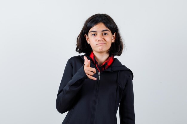 Expressive young girl posing in the studio