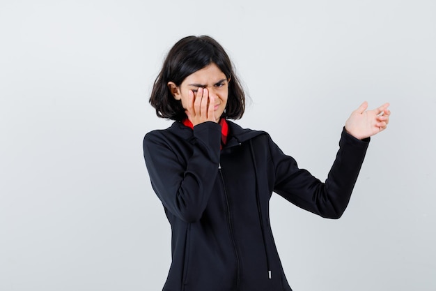 Expressive young girl posing in the studio