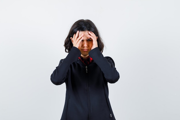 Expressive young girl posing in the studio