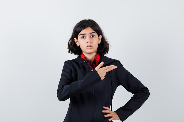 Expressive young girl posing in the studio