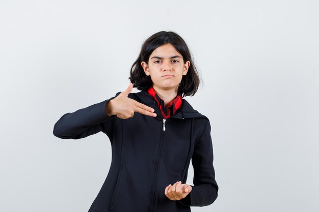 Expressive young girl posing in the studio