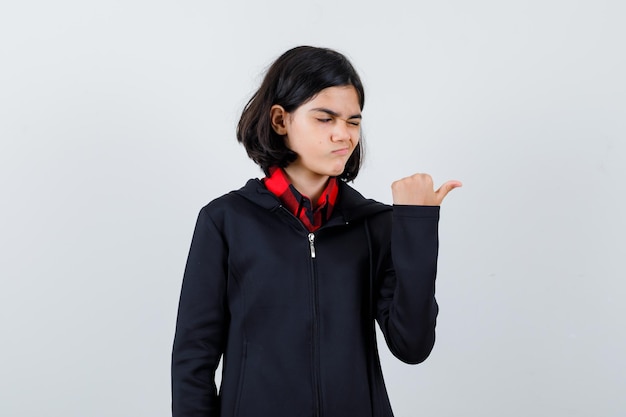 Expressive young girl posing in the studio