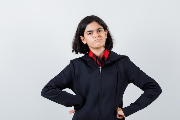 Expressive young girl posing in the studio