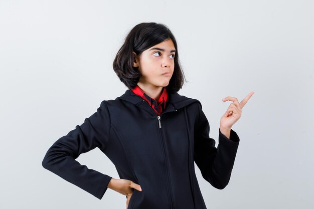 Expressive young girl posing in the studio