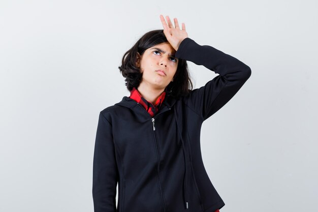 Expressive young girl posing in the studio