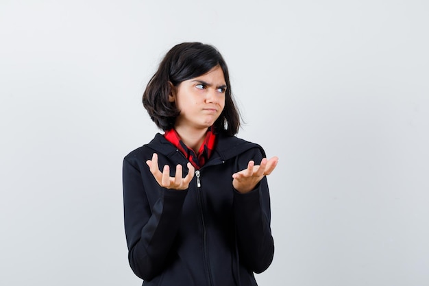 Expressive young girl posing in the studio